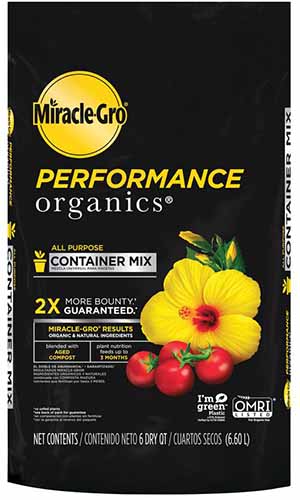 نمای نزدیک از بسته بندی مشکی با متن زرد خاک گلدان Miracle-Gro Performance Organics در زمینه سفید.